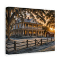 A square First Frost canvas print showing a historic Southern farmhouse with a wraparound porch, frost-covered yard, wooden fence, oak branches, and a small red barn in warm sunrise light, photographed at an angle on white.