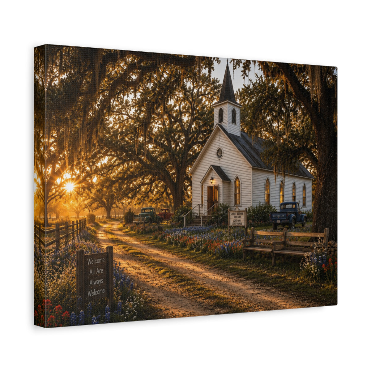 A rectangular The Country Church canvas print showing a small white country church with a steeple beside a dirt path, framed by moss-draped oak trees, rustic benches, wildflowers, and warm sunset light, photographed at an angle on a white background.