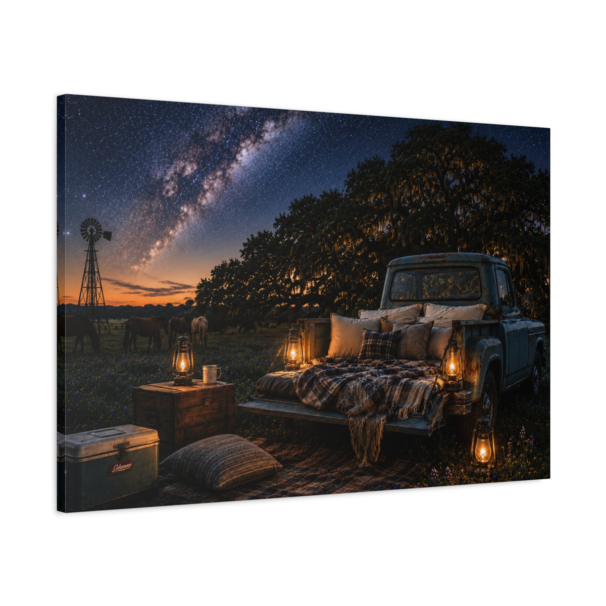 A rectangular Starry Night canvas print showing a cozy outdoor bed beside a vintage pickup in a country field, with lanterns, pillows, blankets, windmills, and the Milky Way overhead, photographed at an angle on a white background.