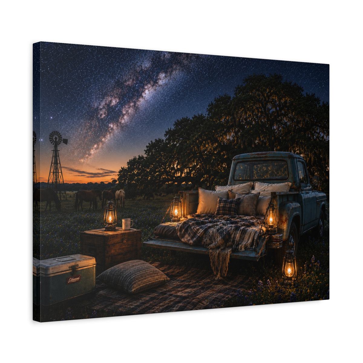 A rectangular Starry Night canvas print showing a cozy outdoor bed beside a vintage pickup in a country field, with lanterns, pillows, blankets, windmills, and the Milky Way overhead, photographed at an angle on a white background.