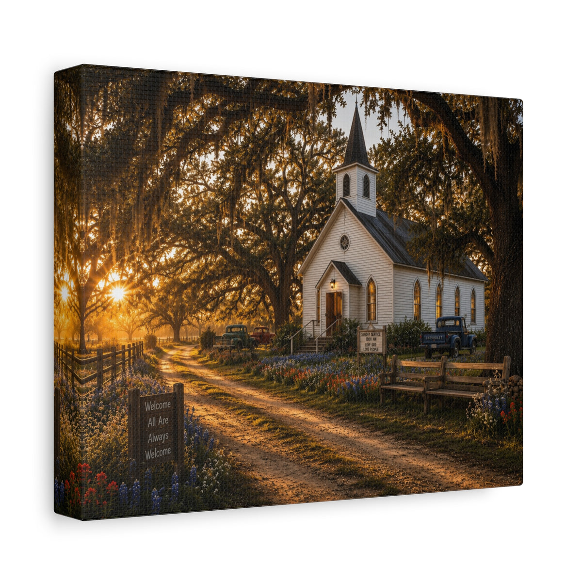 A square The Country Church canvas print showing a small white country church with a steeple beside a dirt path, framed by moss-draped oak trees, rustic benches, wildflowers, and warm sunset light, photographed at an angle on a white background.