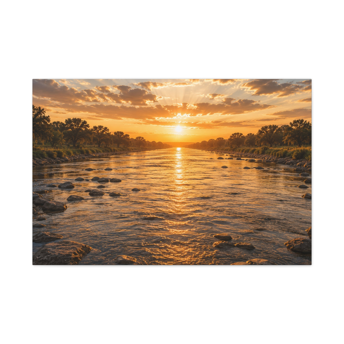 A rectangular The River wall art print showing a golden sunset over a shallow river, with rocks in the water, tree-lined banks, glowing reflections, and sunbeams breaking through the clouds, centered on a light gray background.