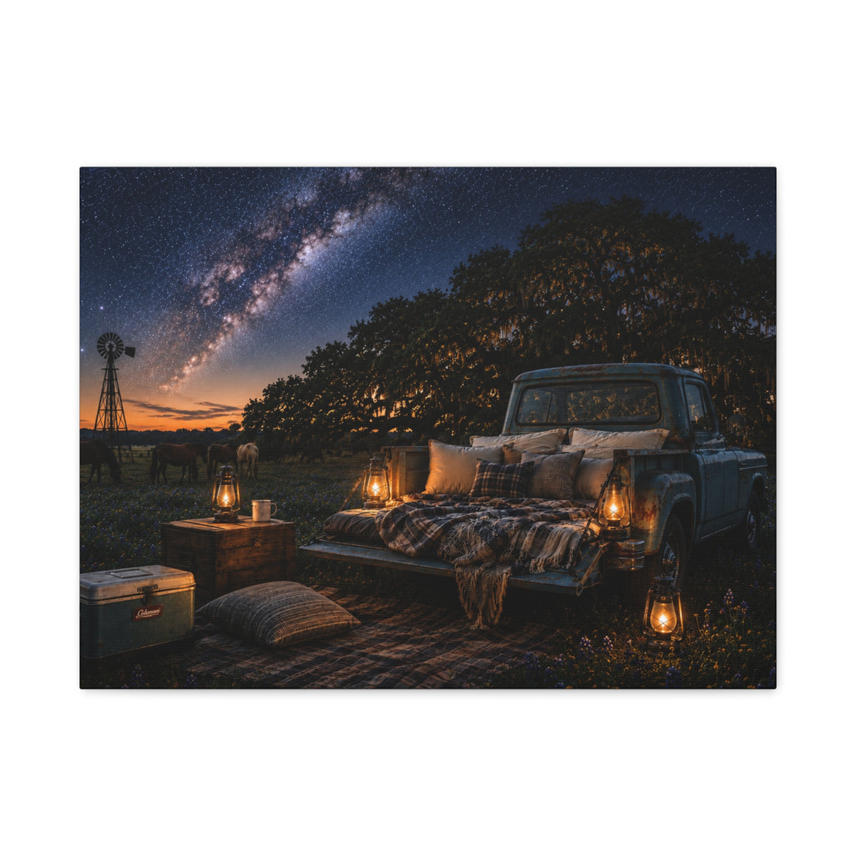A rectangular Starry Night canvas print showing a cozy outdoor bed beside a vintage pickup in a country field, with lanterns, pillows, blankets, windmills, and the Milky Way overhead, photographed on a white background.